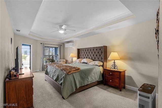26 NW 29th Pl, Cape Coral, FL 33993 - bedroom featuring a tray ceiling, a wall unit AC, light colored carpet, and visible vents