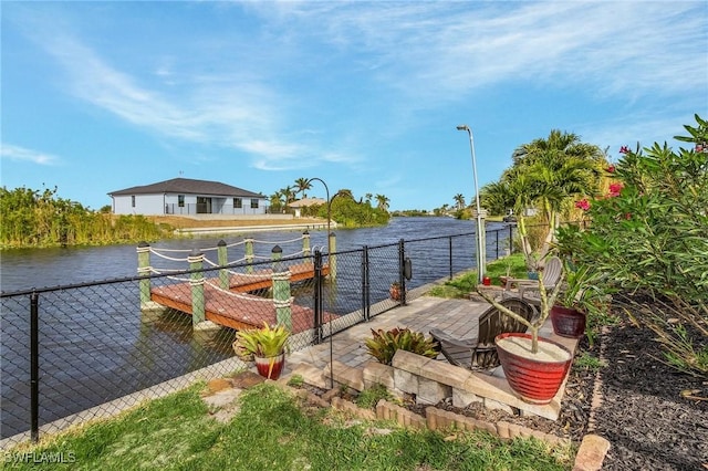 26 NW 29th Pl, Cape Coral, FL 33993 - dock area with a water view and fence