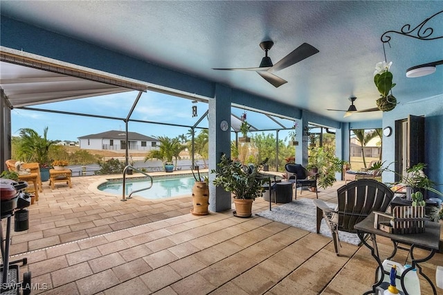 26 NW 29th Pl, Cape Coral, FL 33993 - exterior space with an outdoor pool, glass enclosure, and a ceiling fan