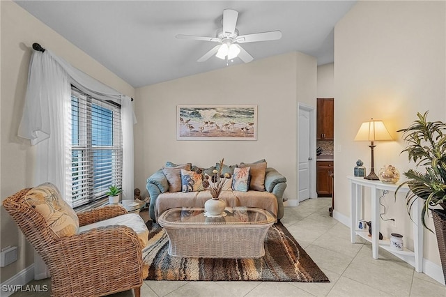 26 NW 29th Pl, Cape Coral, FL 33993 - living area with light tile patterned floors, ceiling fan, baseboards, and lofted ceiling