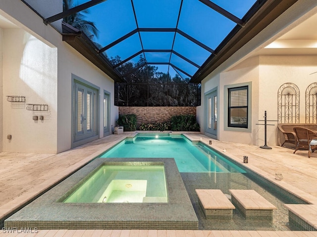 view of pool with french doors, a patio area, a fenced in pool, and an in ground hot tub