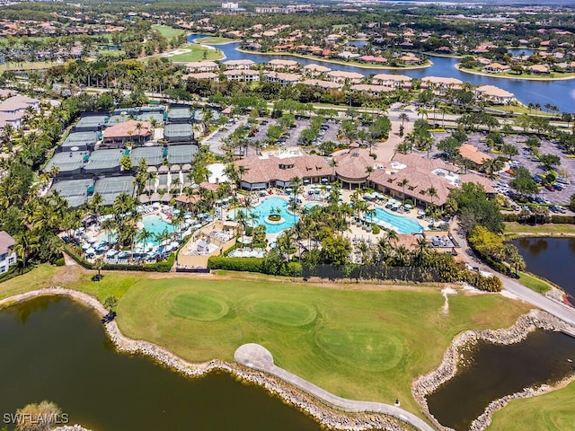 birds eye view of property with a water view, golf course view, and a residential view