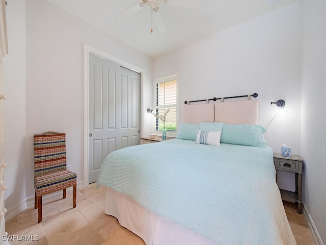 bedroom featuring a closet, baseboards, and a ceiling fan