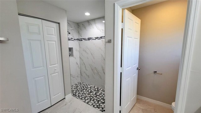 1138 Argosy Rd, Labelle, FL 33935 - bathroom featuring marble finish flooring, a marble finish shower, toilet, a closet, and recessed lighting