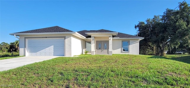 1138 Argosy Rd, Labelle, FL 33935 - view of front of house with a front yard, concrete driveway, stucco siding, and an attached garage
