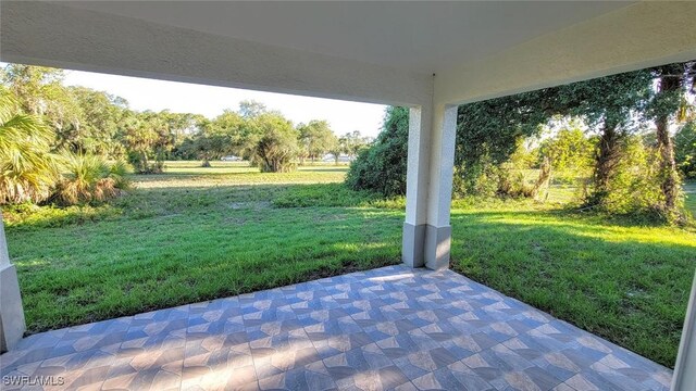 1138 Argosy Rd, Labelle, FL 33935 - view of patio / terrace featuring view of scattered trees
