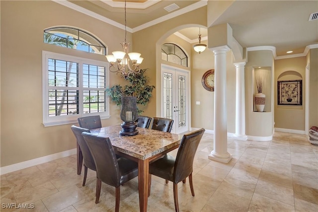 144 SW 54th Ter, Cape Coral, FL 33914 - dining space featuring visible vents, baseboards, ornamental molding, and arched walkways