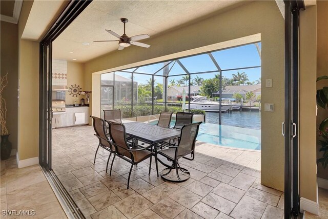 144 SW 54th Ter, Cape Coral, FL 33914 - exterior space with a water view, a swimming pool, outdoor dining space, and ceiling fan