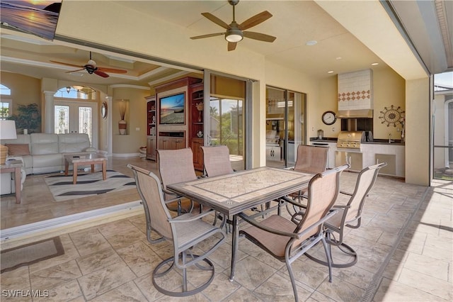 144 SW 54th Ter, Cape Coral, FL 33914 - view of patio / terrace featuring area for grilling, french doors, outdoor dining space, ceiling fan, and grilling area