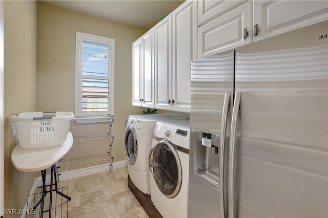 144 SW 54th Ter, Cape Coral, FL 33914 - laundry room featuring washing machine and clothes dryer, baseboards, and cabinet space