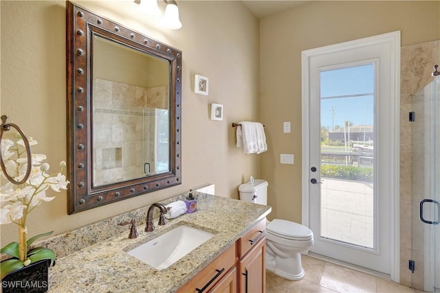 144 SW 54th Ter, Cape Coral, FL 33914 - bathroom featuring tile patterned floors, vanity, toilet, and a stall shower