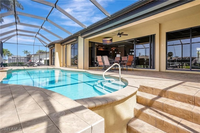 144 SW 54th Ter, Cape Coral, FL 33914 - pool with glass enclosure, a patio, and ceiling fan