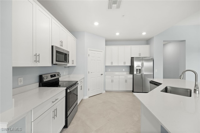 12000 Santaluz Dr Unit 202, Fort Myers, FL 33913 - kitchen featuring white cabinets, visible vents, stainless steel appliances, and a sink
