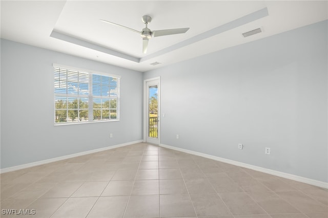12000 Santaluz Dr Unit 202, Fort Myers, FL 33913 - unfurnished room with baseboards, a ceiling fan, visible vents, and a tray ceiling