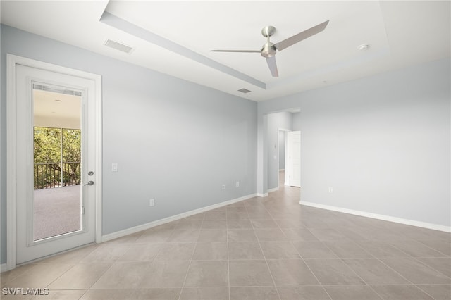 12000 Santaluz Dr Unit 202, Fort Myers, FL 33913 - empty room featuring baseboards, visible vents, ceiling fan, and a tray ceiling