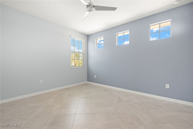 12000 Santaluz Dr Unit 202, Fort Myers, FL 33913 - unfurnished room featuring light tile patterned floors, baseboards, and ceiling fan
