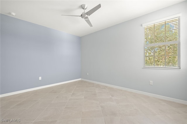 12000 Santaluz Dr Unit 202, Fort Myers, FL 33913 - spare room featuring ceiling fan, vaulted ceiling, and baseboards