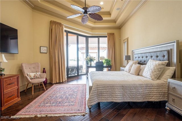 bedroom with dark wood-type flooring, a tray ceiling, ornamental molding, access to exterior, and baseboards