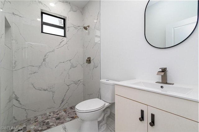 3314 43rd St W, Lehigh Acres, FL 33971 - full bathroom featuring vanity, marble finish floor, toilet, and a marble finish shower