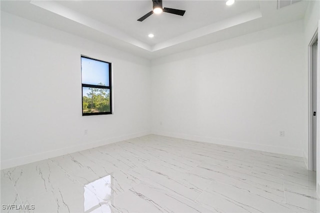 3314 43rd St W, Lehigh Acres, FL 33971 - empty room featuring a raised ceiling, baseboards, a ceiling fan, and recessed lighting