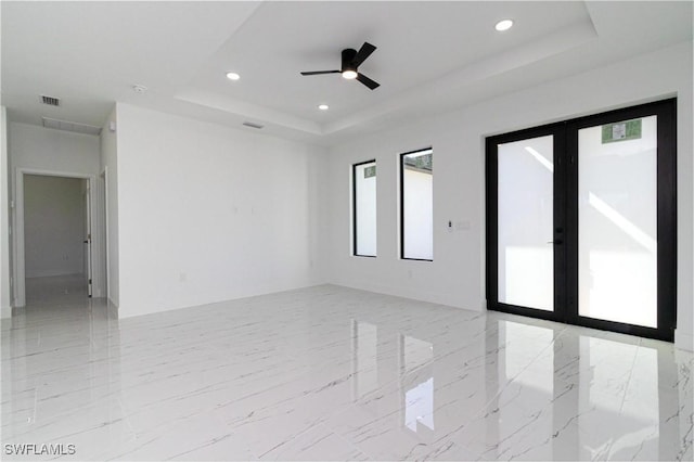 3314 43rd St W, Lehigh Acres, FL 33971 - empty room featuring recessed lighting, french doors, visible vents, and a raised ceiling