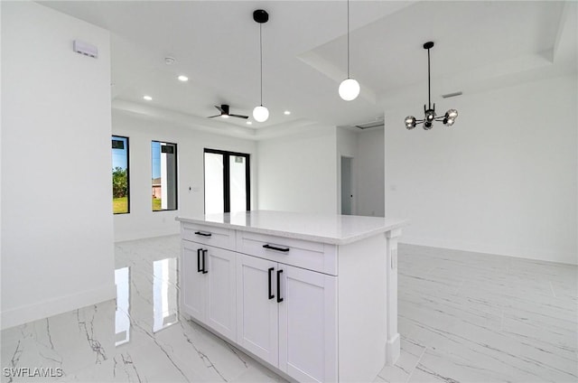 3314 43rd St W, Lehigh Acres, FL 33971 - kitchen with baseboards, open floor plan, a tray ceiling, recessed lighting, and marble finish floor