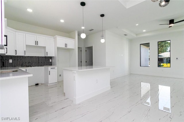3314 43rd St W, Lehigh Acres, FL 33971 - kitchen featuring recessed lighting, open floor plan, decorative backsplash, and a kitchen island