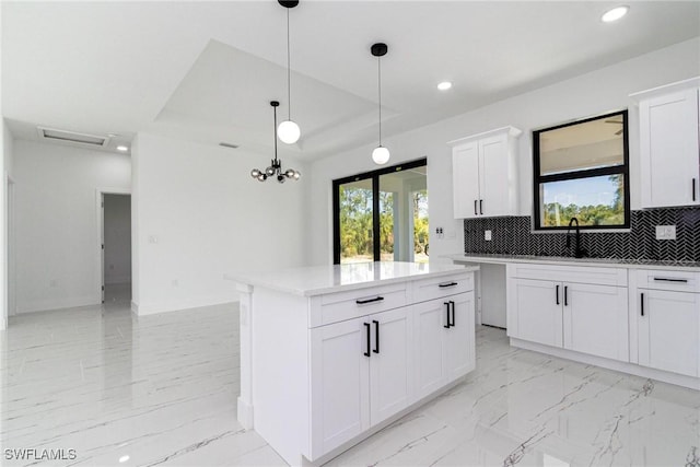 3314 43rd St W, Lehigh Acres, FL 33971 - kitchen featuring marble finish floor, decorative backsplash, a sink, and recessed lighting