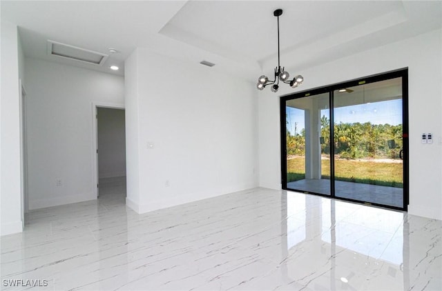 3314 43rd St W, Lehigh Acres, FL 33971 - empty room with marble finish floor, visible vents, a tray ceiling, and attic access