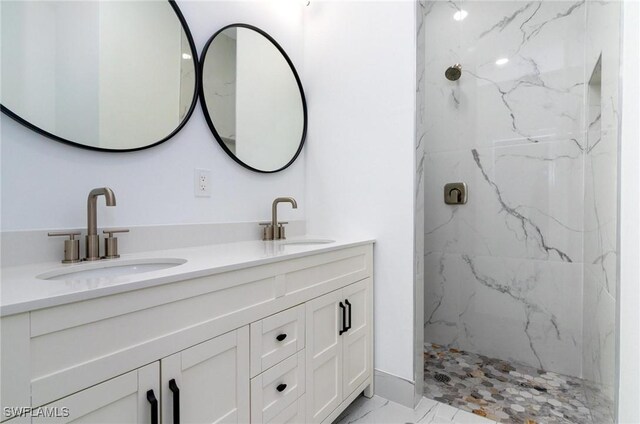 3314 43rd St W, Lehigh Acres, FL 33971 - bathroom with double vanity, marble finish floor, a sink, and a marble finish shower