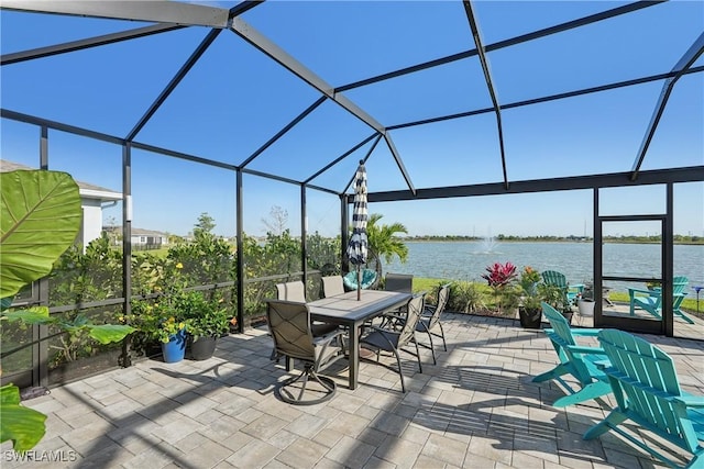 847 Stonewater Lake Ter, Cape Coral, FL 33993 - view of patio / terrace with a water view, glass enclosure, and outdoor dining space