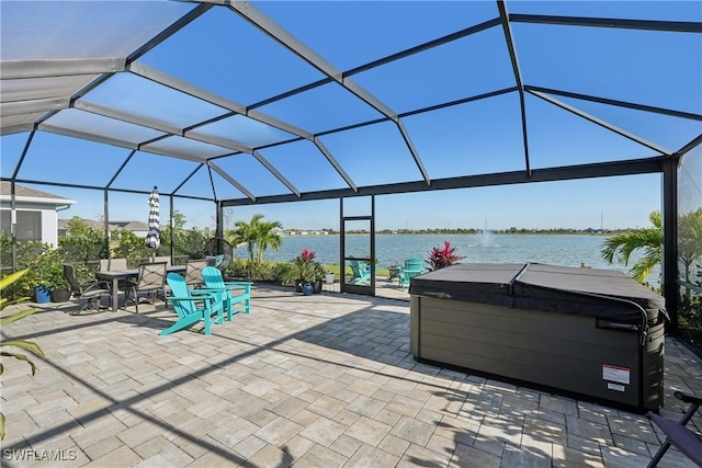 847 Stonewater Lake Ter, Cape Coral, FL 33993 - view of patio / terrace with a hot tub, a water view, and glass enclosure