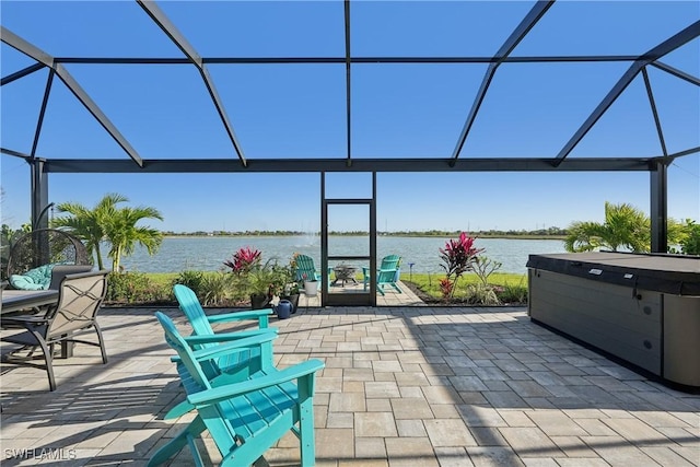 847 Stonewater Lake Ter, Cape Coral, FL 33993 - view of patio / terrace featuring a lanai, a hot tub, and a water view