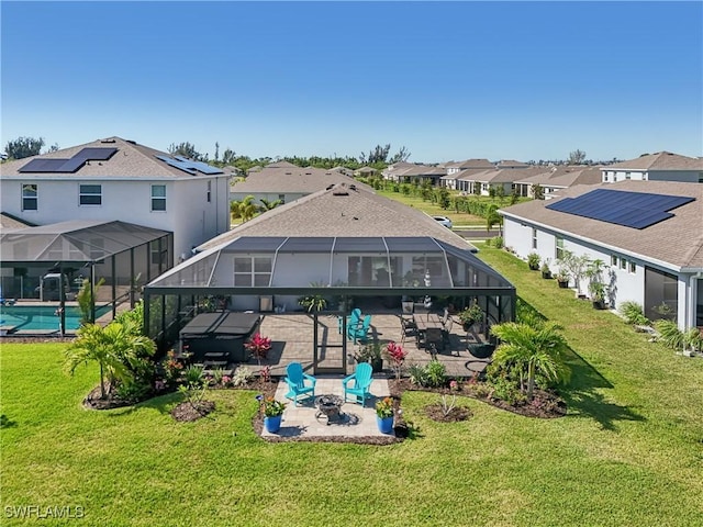 847 Stonewater Lake Ter, Cape Coral, FL 33993 - back of house featuring a patio area, a lanai, a residential view, and a yard