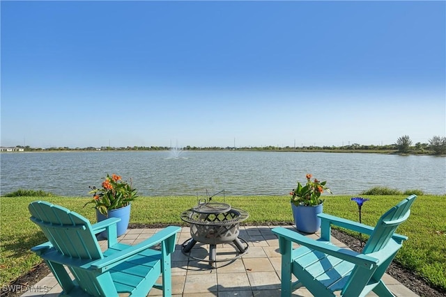 847 Stonewater Lake Ter, Cape Coral, FL 33993 - view of patio with a fire pit and a water view