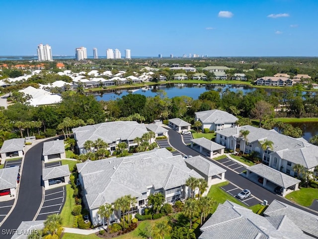 birds eye view of property featuring a water view and a residential view