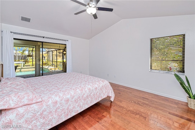 205 SW 42nd Ter, Cape Coral, FL 33914 - bedroom with vaulted ceiling, wood finished floors, baseboards, access to outside, and a ceiling fan