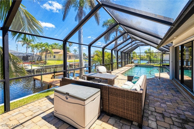 205 SW 42nd Ter, Cape Coral, FL 33914 - view of patio featuring an outdoor pool, glass enclosure, and a water view