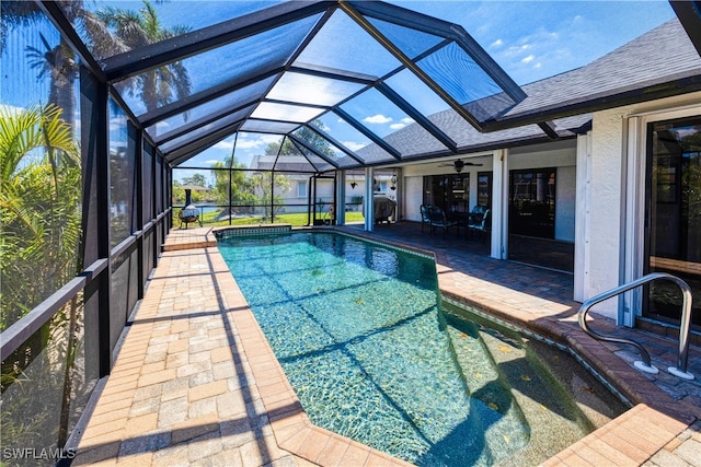 205 SW 42nd Ter, Cape Coral, FL 33914 - swimming pool featuring a patio area, ceiling fan, and glass enclosure