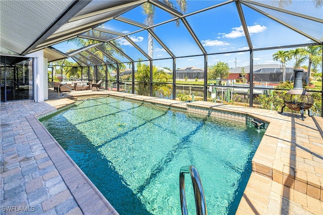 205 SW 42nd Ter, Cape Coral, FL 33914 - outdoor pool featuring a patio area, a lanai, a water view, and a residential view
