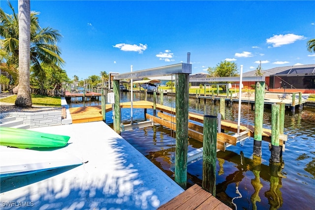 205 SW 42nd Ter, Cape Coral, FL 33914 - dock area featuring boat lift and a water view