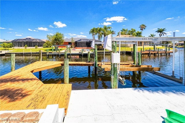 205 SW 42nd Ter, Cape Coral, FL 33914 - dock area with boat lift and a water view