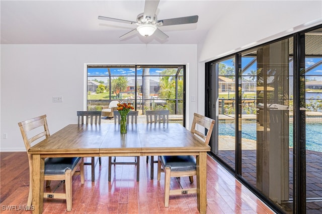205 SW 42nd Ter, Cape Coral, FL 33914 - dining space featuring ceiling fan, wood finished floors, and baseboards