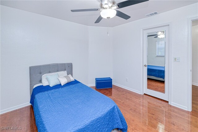 205 SW 42nd Ter, Cape Coral, FL 33914 - bedroom with wood finished floors, baseboards, and ceiling fan