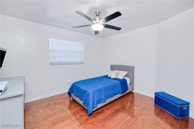 205 SW 42nd Ter, Cape Coral, FL 33914 - bedroom with wood finished floors, baseboards, and a ceiling fan
