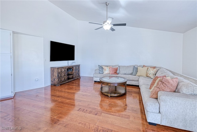 205 SW 42nd Ter, Cape Coral, FL 33914 - living room featuring wood finished floors, a ceiling fan, vaulted ceiling, and baseboards