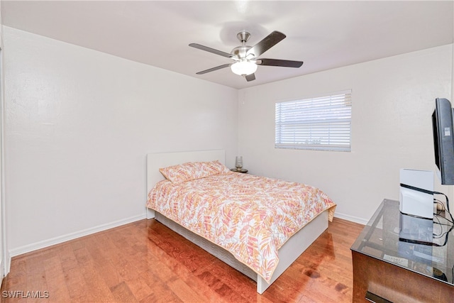 205 SW 42nd Ter, Cape Coral, FL 33914 - bedroom featuring light wood-style flooring, baseboards, and ceiling fan