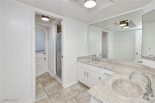 205 SW 42nd Ter, Cape Coral, FL 33914 - full bathroom with double vanity, tile patterned floors, a stall shower, baseboards, and ceiling fan