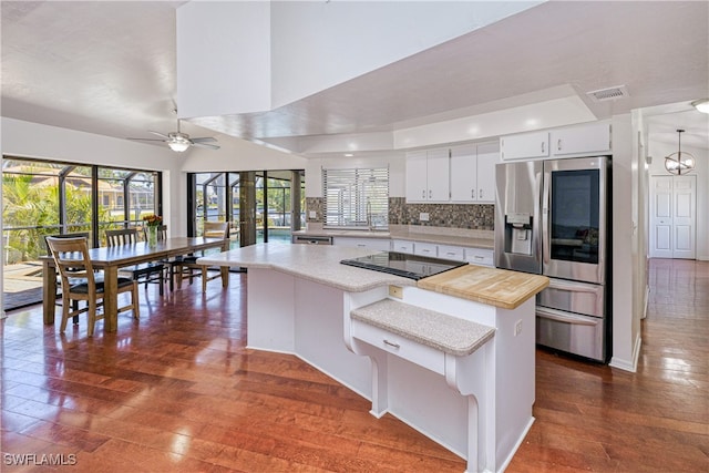 205 SW 42nd Ter, Cape Coral, FL 33914 - kitchen featuring stainless steel appliances, light countertops, ceiling fan, and plenty of natural light