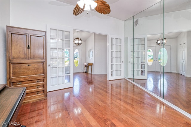 205 SW 42nd Ter, Cape Coral, FL 33914 - foyer with french doors, hardwood / wood-style flooring, a chandelier, ceiling fan, and lofted ceiling